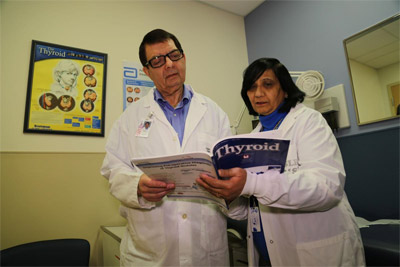 Doctors reading magazine