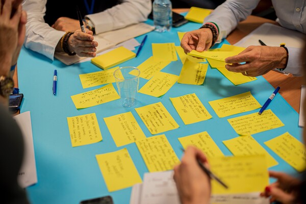 Group using post-it notes in meeting