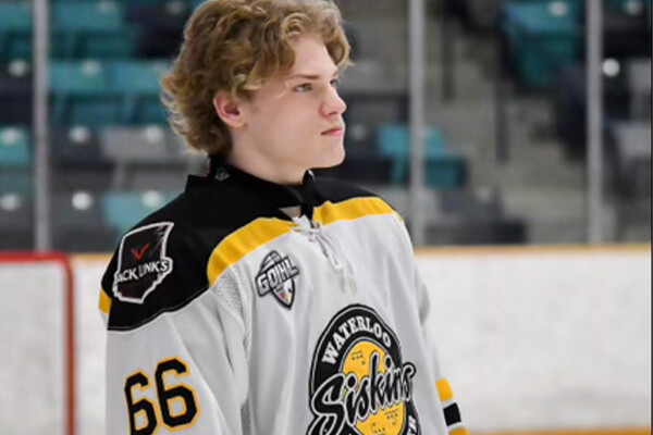 A blond hockey player with number 66 on his jersey 