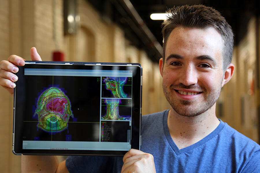Aaron Babier (MIE PhD candidate) demonstrates his AI-based software’s visualization capabilities. (Credit: Brian Tran)