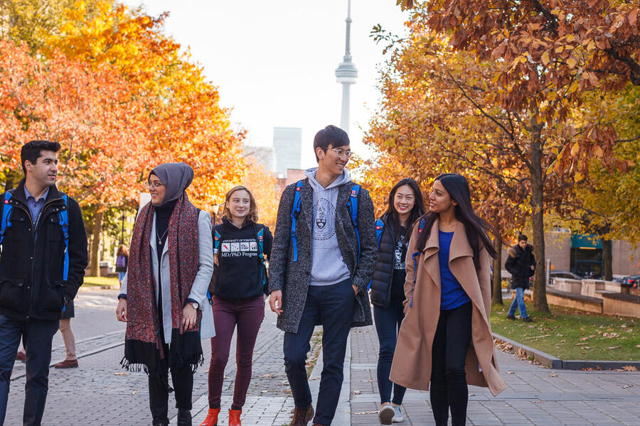 Med Students walking on campus.