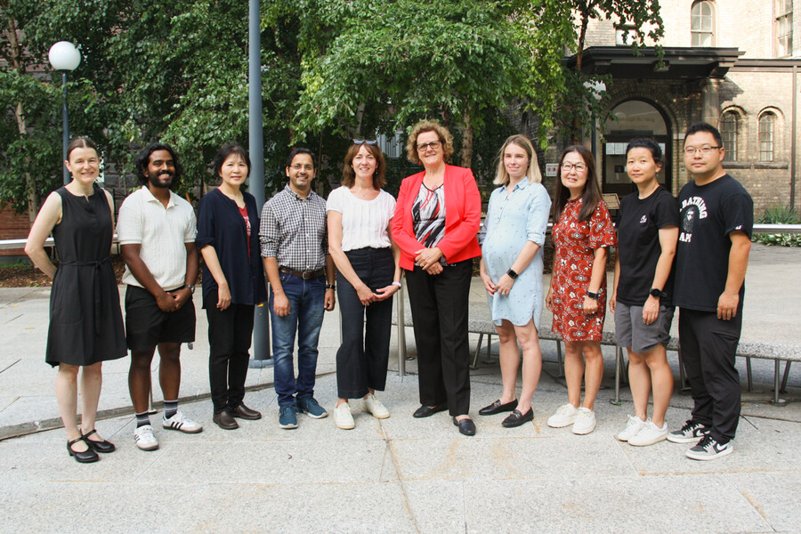 Group photo of researchers, outside on U of T campus