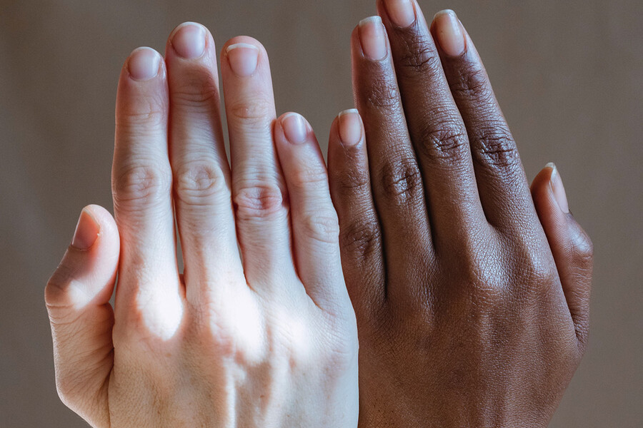 Hands of individuals with diverse skin types