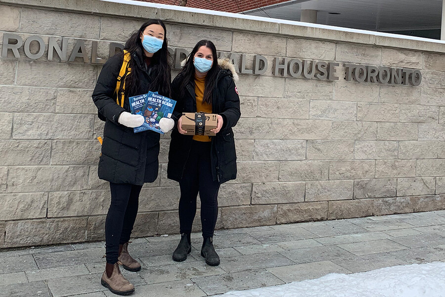 Sabrina Wang and Nairy Khodabakhshian hold books