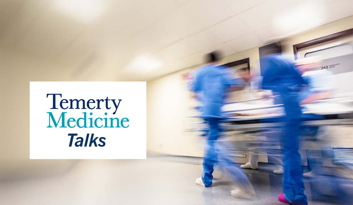 Temerty Medicine Talks, people in scrubs moving hospital bed through hallway