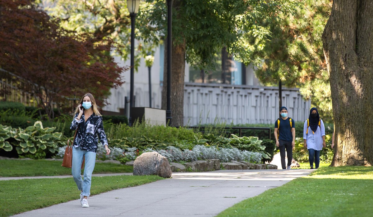 Students walking on path by Medical Sciences Building