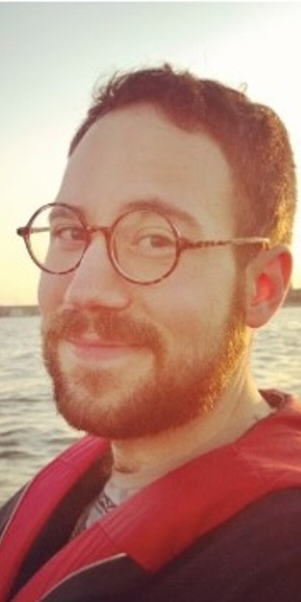 A selfie of Dr. Chase McMurren in front of a lake
