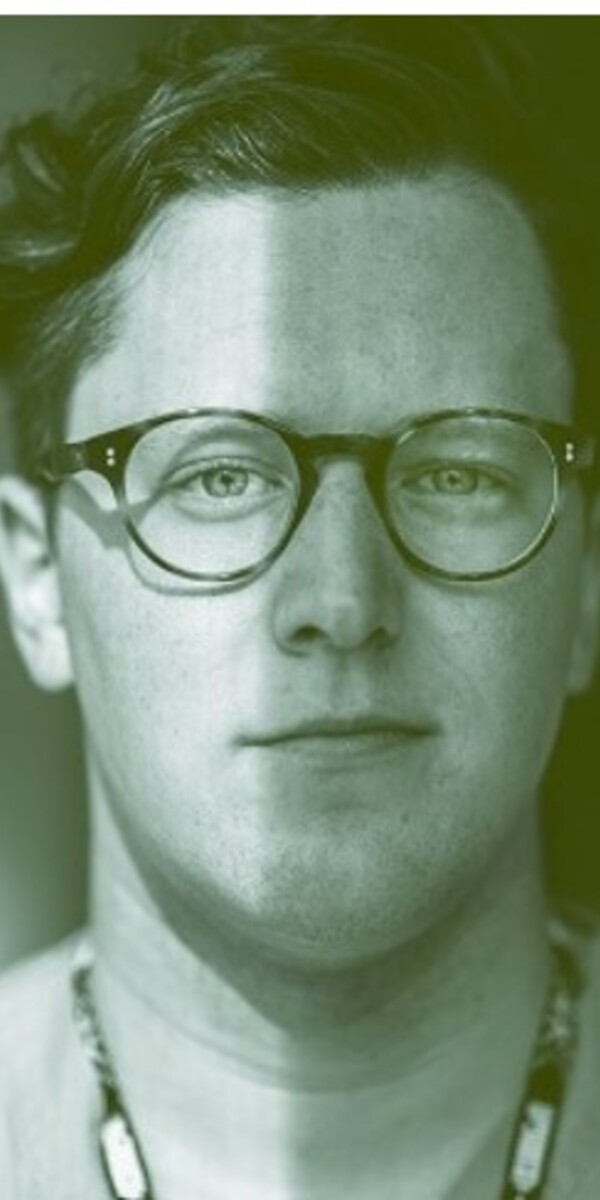 A black and white image of Dr. Ryan Giroux