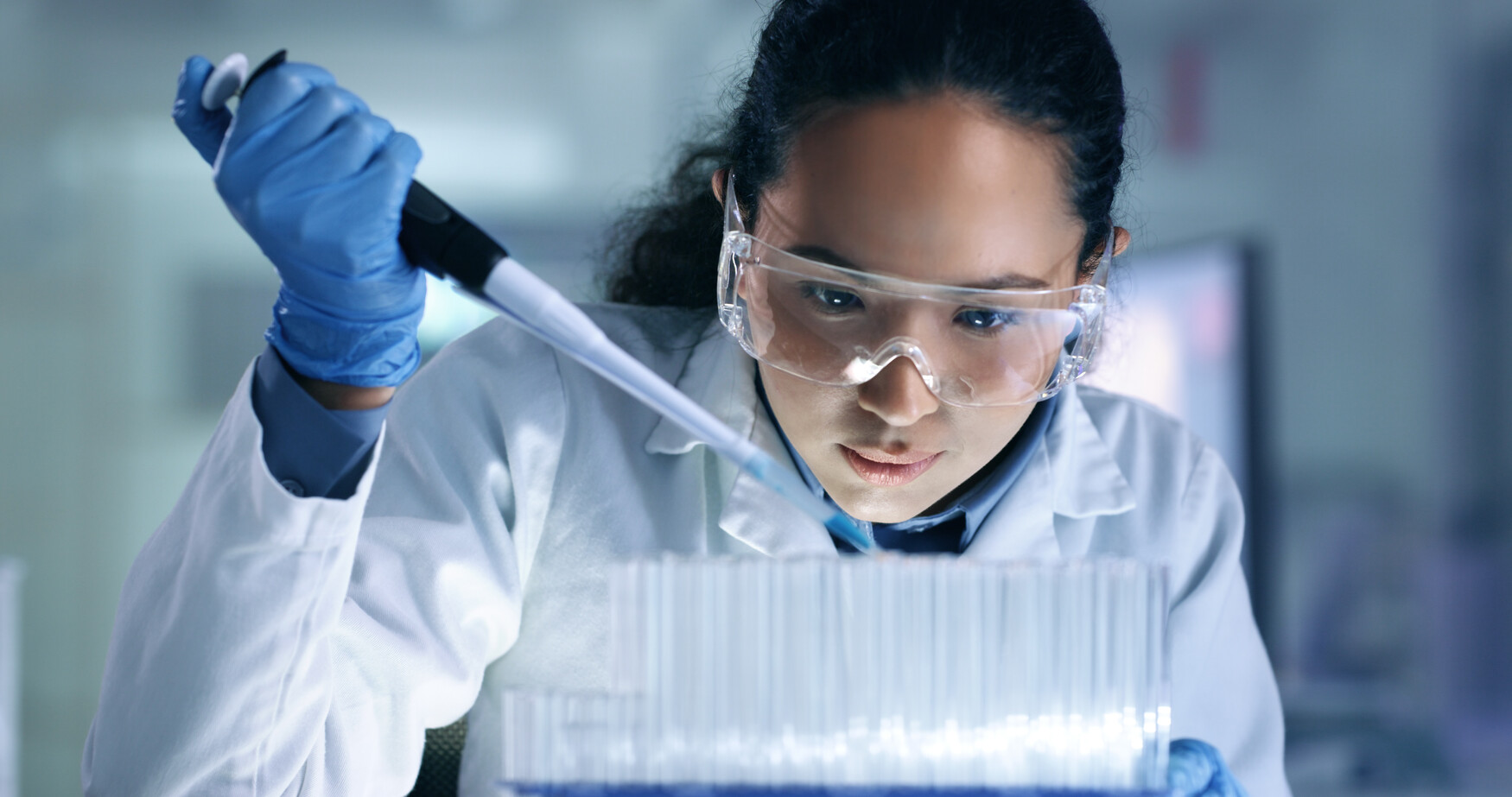 scientist uses a pipette