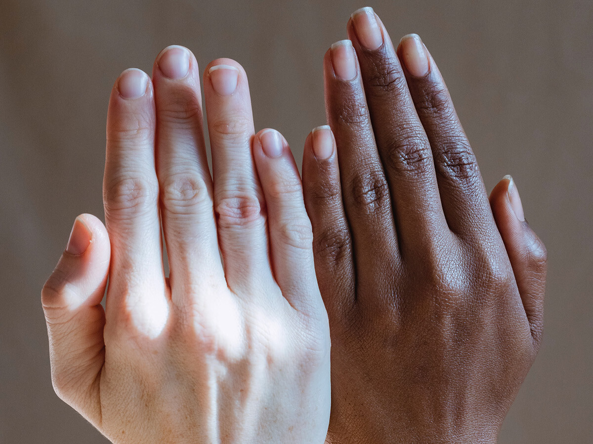 Hands of individuals with diverse skin types