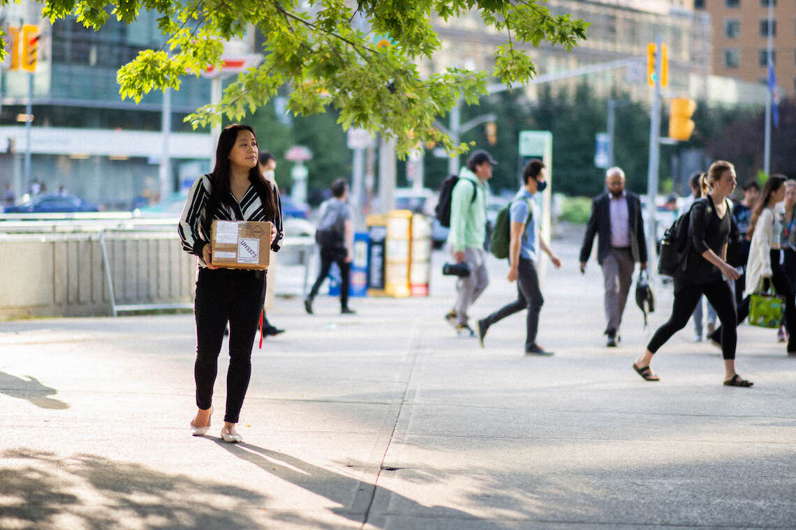 Jessica Lam on street with lab package