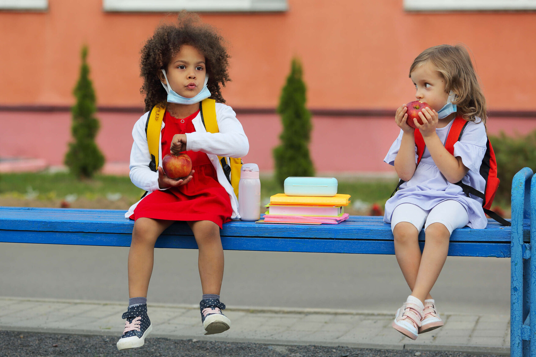 Children with food and masks at school