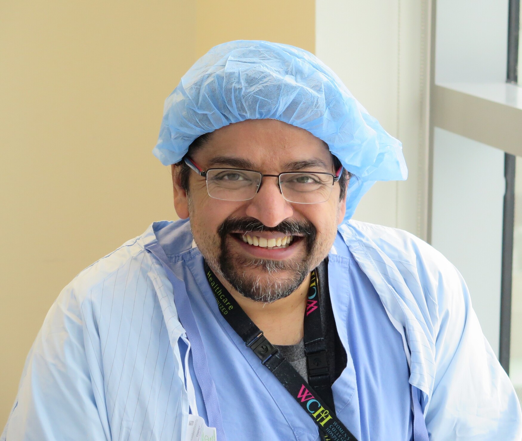 head and shoulders of man in surgical gown