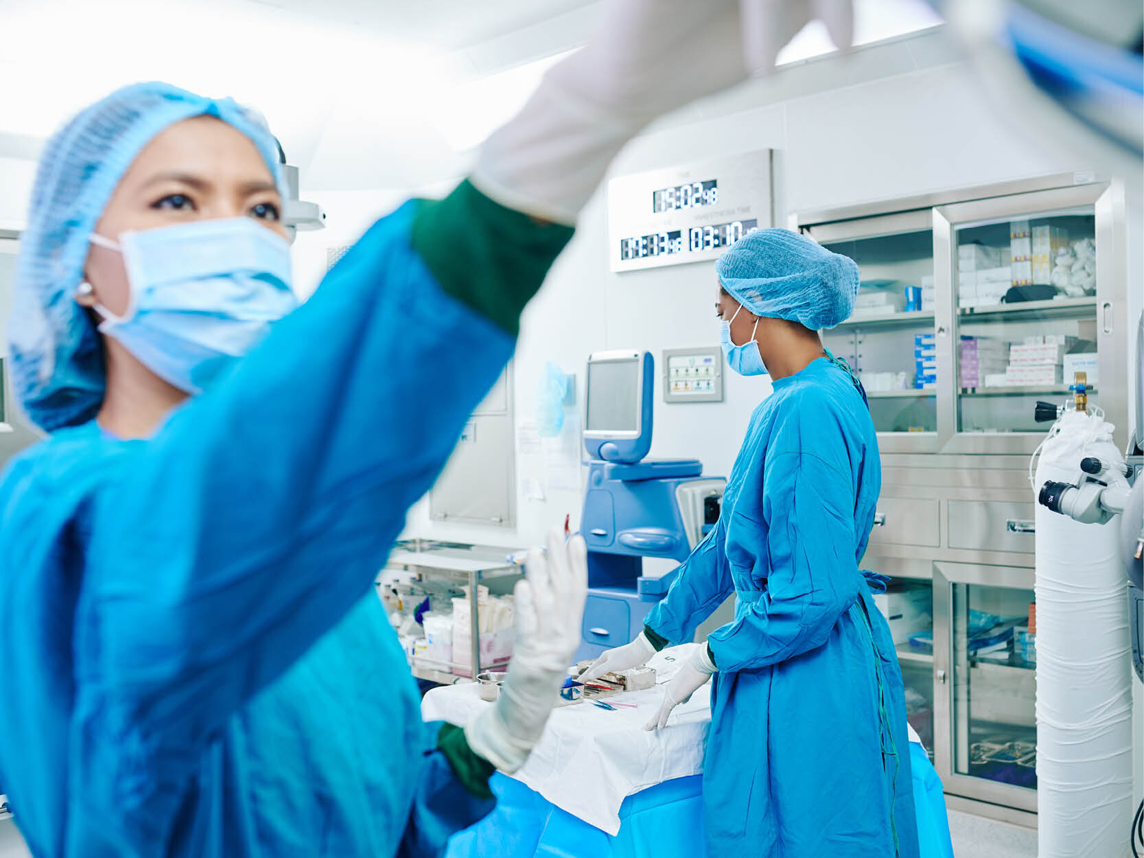 Surgical team preparing operating theater for upcoming surgery