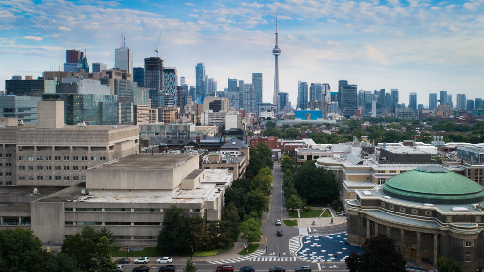 University of Toronto's Medical Sciences Building and Convocation Hall with the CN Tower visible in the background.