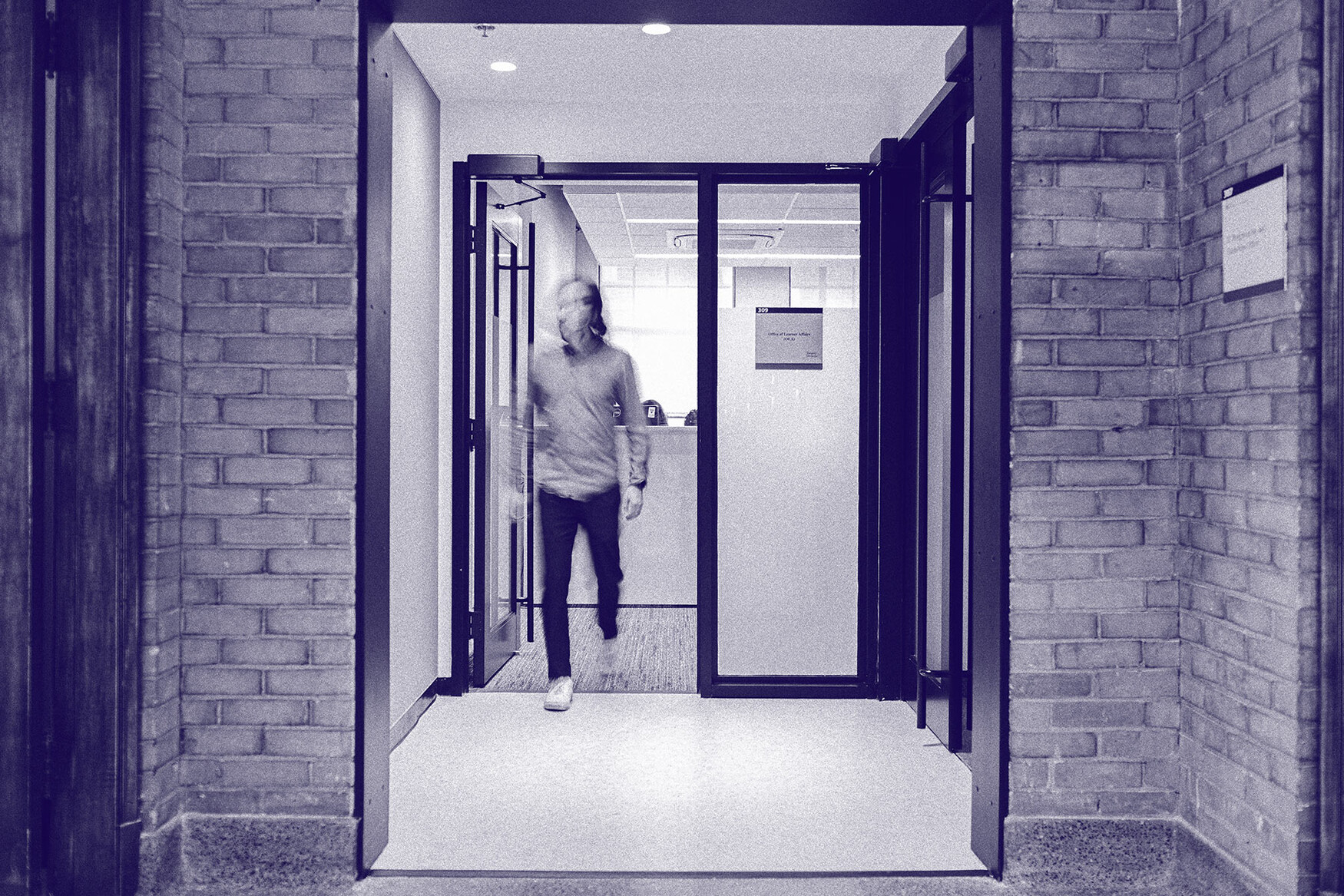 person walking through a door