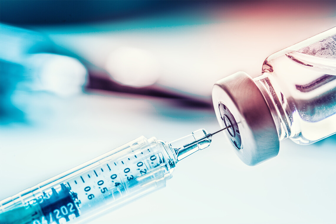 A needle draws insulin from a vial (photo by Marian Vejcik via Getty Images)