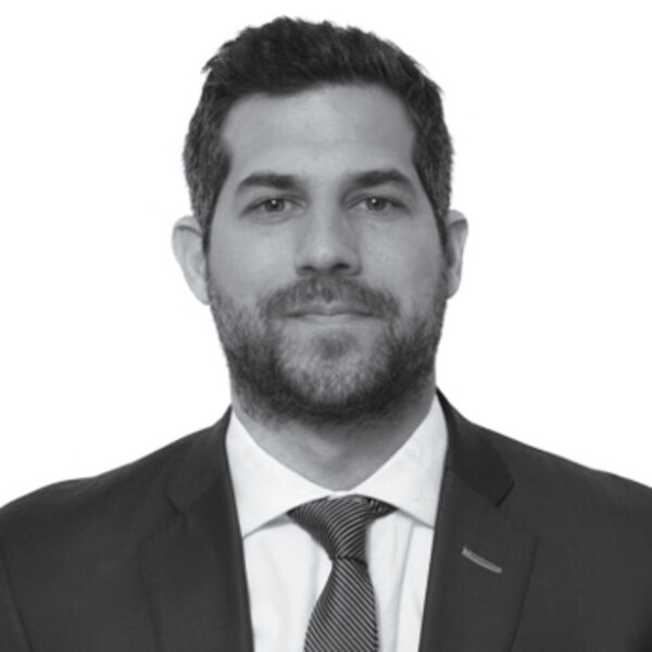 a black and white portrait of a researcher in a suit and tie