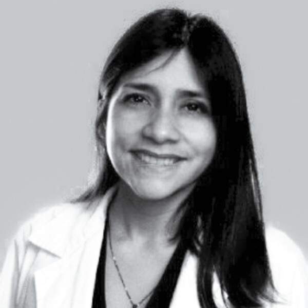 a black and white portrait of a researcher in a white lab coat