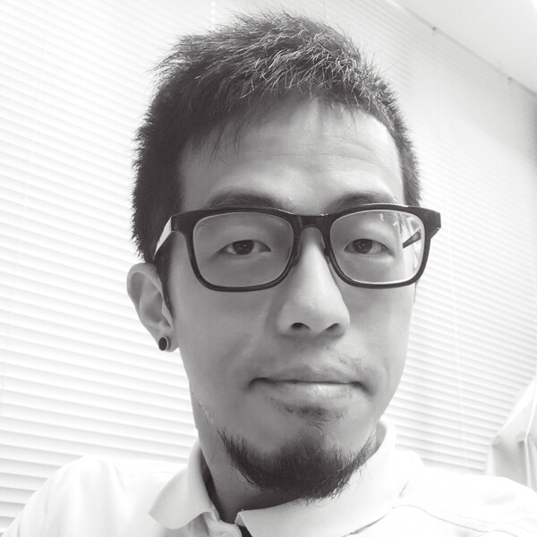 a black and white portrait of a researcher with black glasses