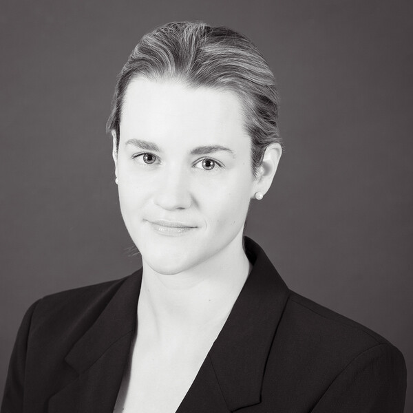 a black and white portrait of a researcher with light hair 