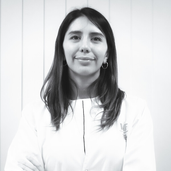 a black and white portrait of a researcher in a white shirt
