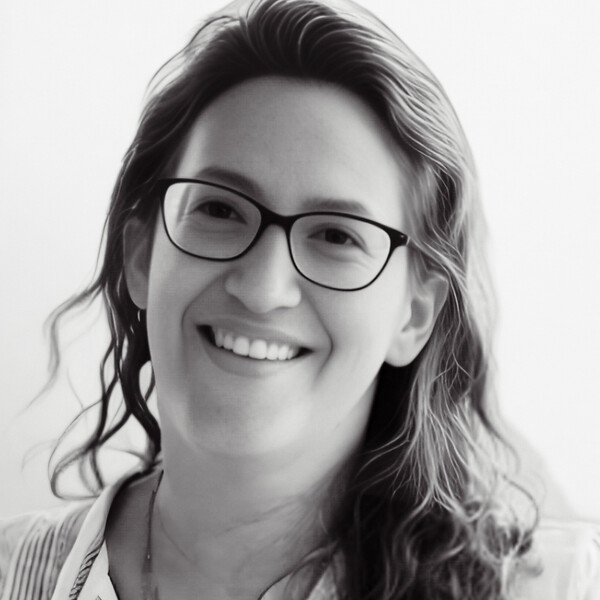 a black and white portrait of a researcher with light, curly hair