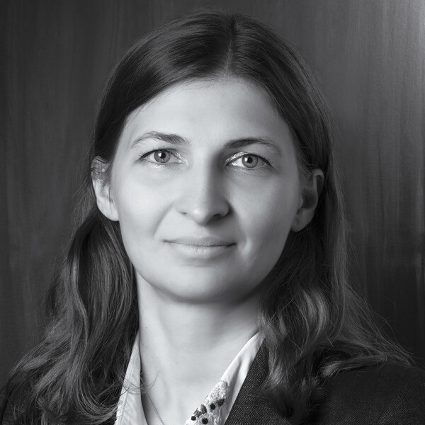 a black and white portrait of a researcher with medium length wavy hair
