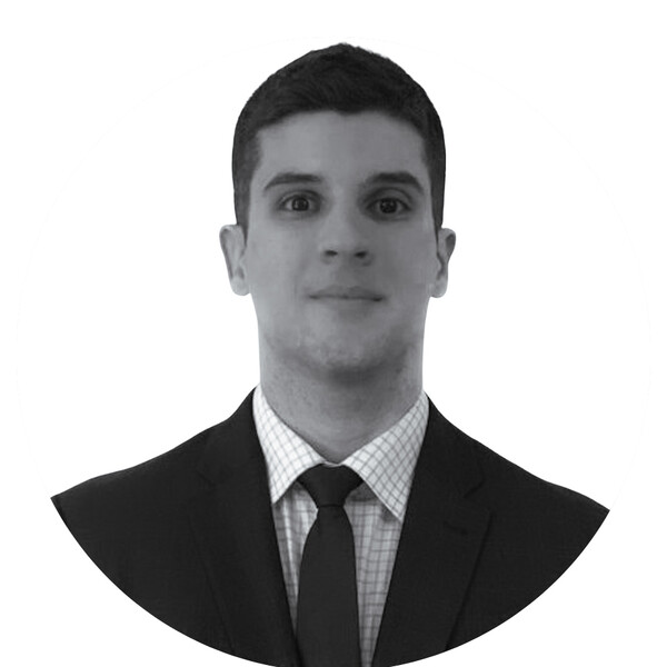 a black and white portrait of a researcher in a suit and tie