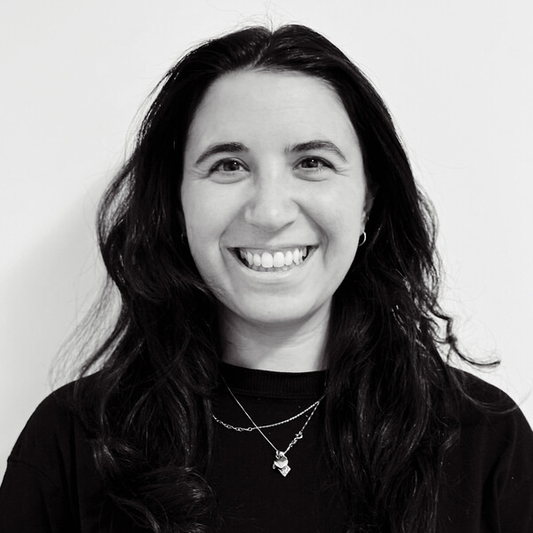 a black and white portrait of a researcher with dark curly hair