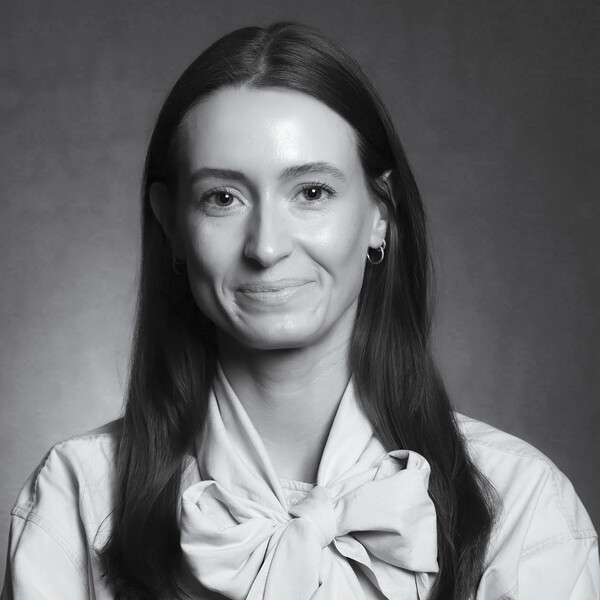 a black and white portrait of a researcher with long dark hair