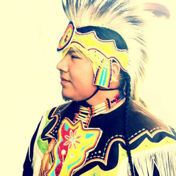 profile view of Indigenous man in regalia